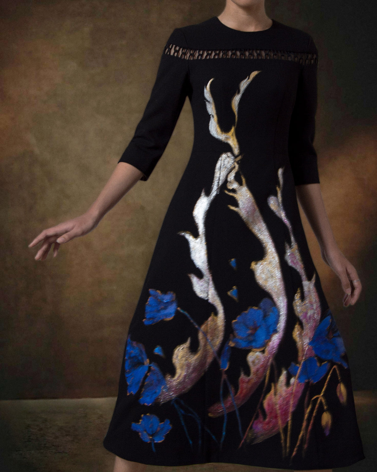 Phoenix in poppy-painted  mid-length Sleeve Black Skater Dress.